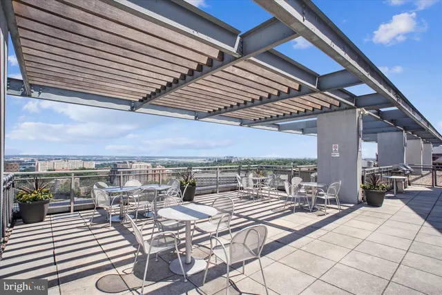 a swimming pool view with a outdoor seating
