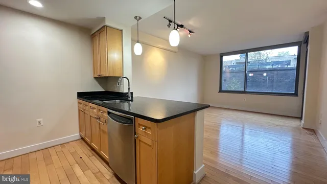 a view of a kitchen sink and a window