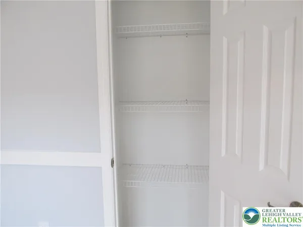a bathroom with a shower and a sink