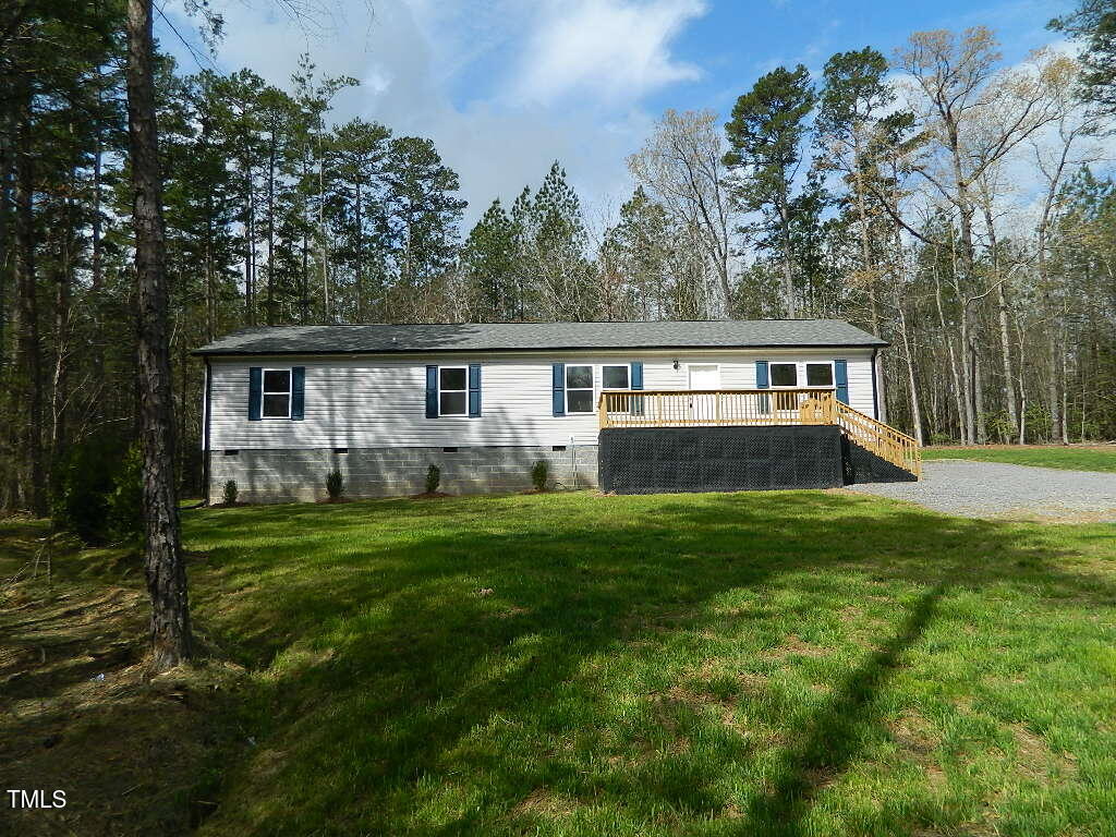 3050 Bennett Siler City Road Bennett, NC 27208 - Photo 39 of 40 a view of a house with backyard and garden