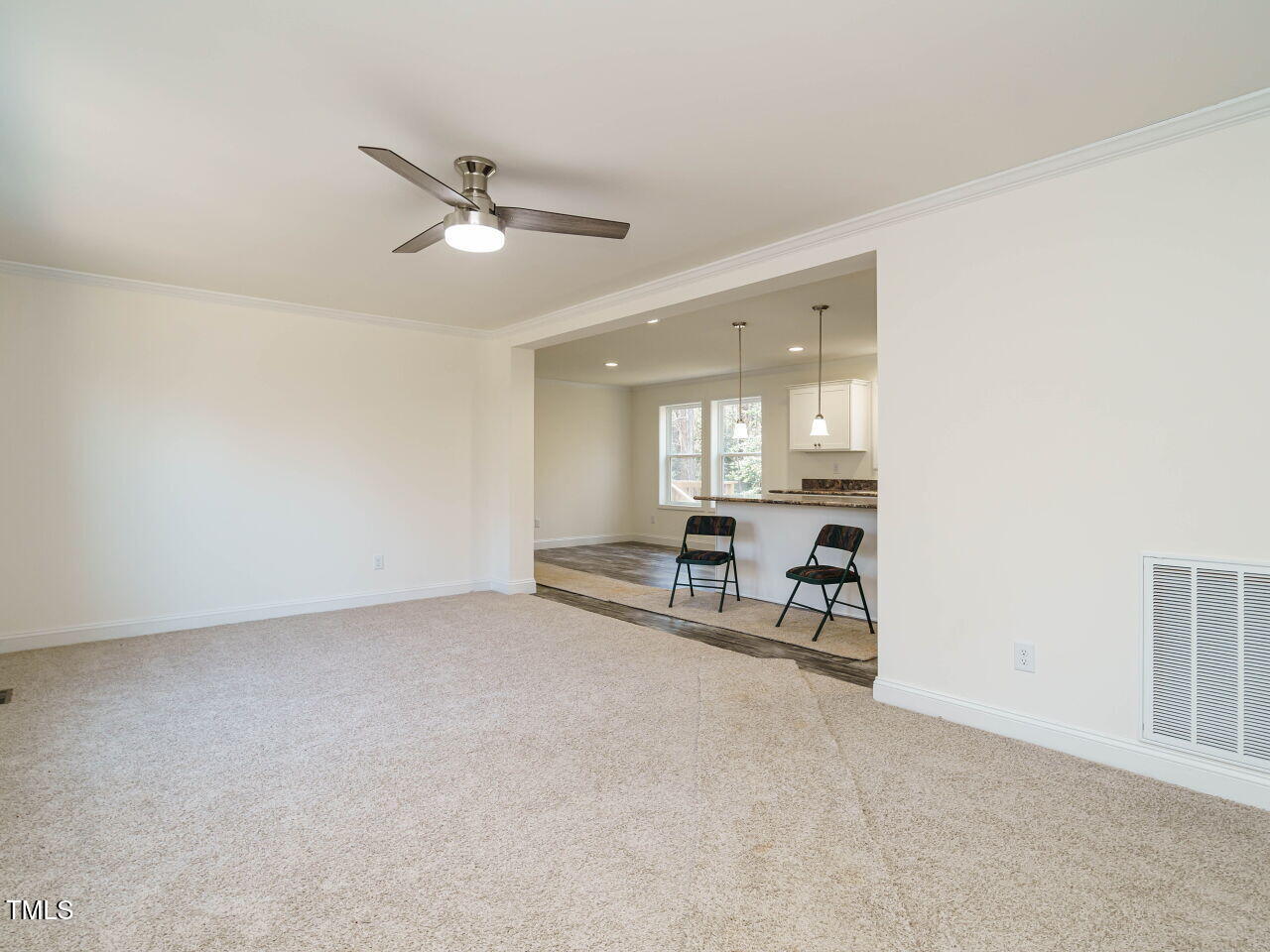3050 Bennett Siler City Road Bennett, NC 27208 - Photo 9 of 40 a view of a livingroom with furniture and a ceiling fan