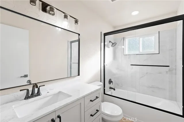 a view of room with hardwood floor and window