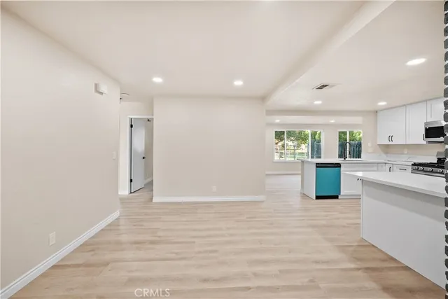 a kitchen with a sink stove and refrigerator