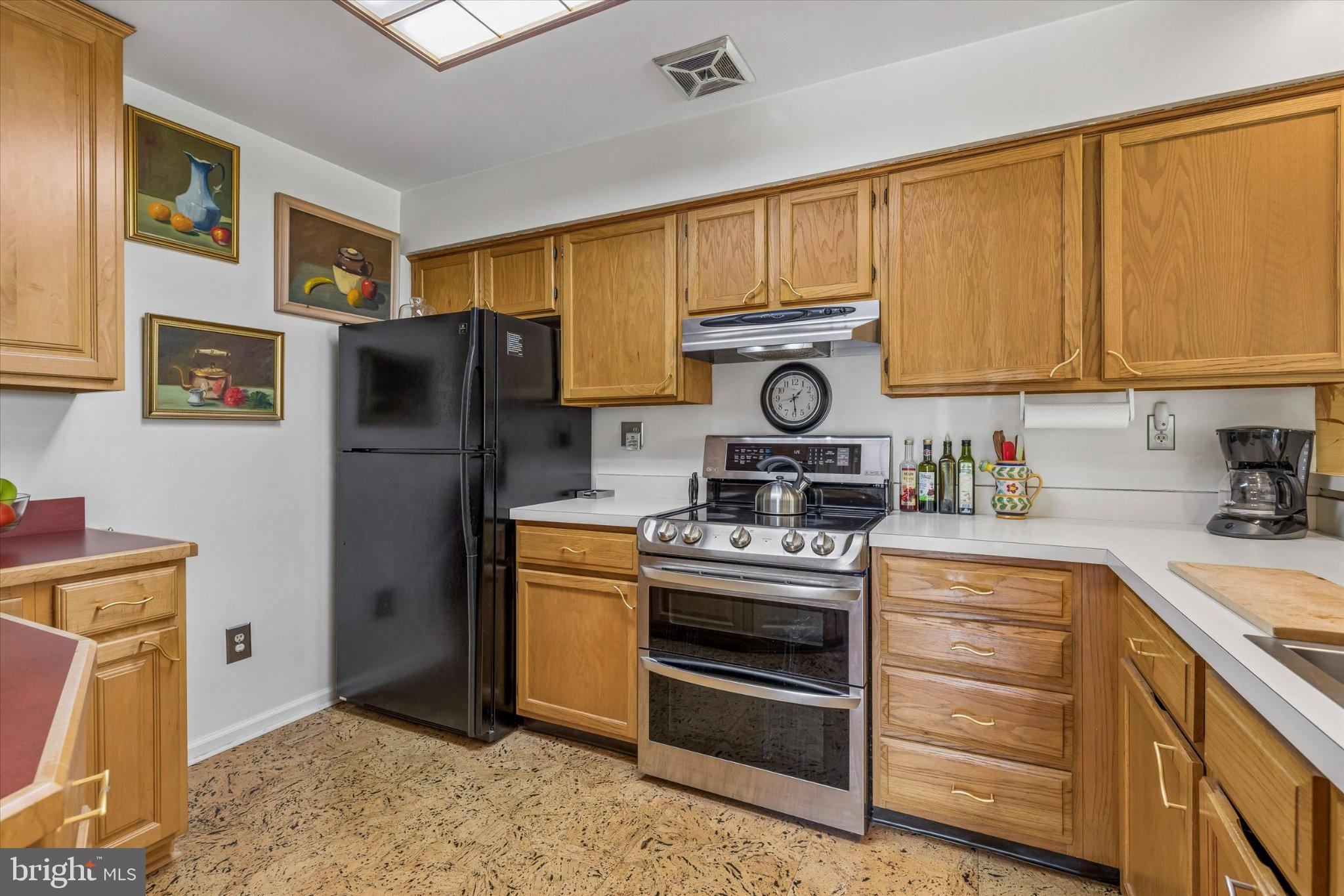 107 Carousel Circle Doylestown, PA 18901 - Photo 12 of 31 a kitchen with stainless steel appliances granite countertop a refrigerator stove and sink