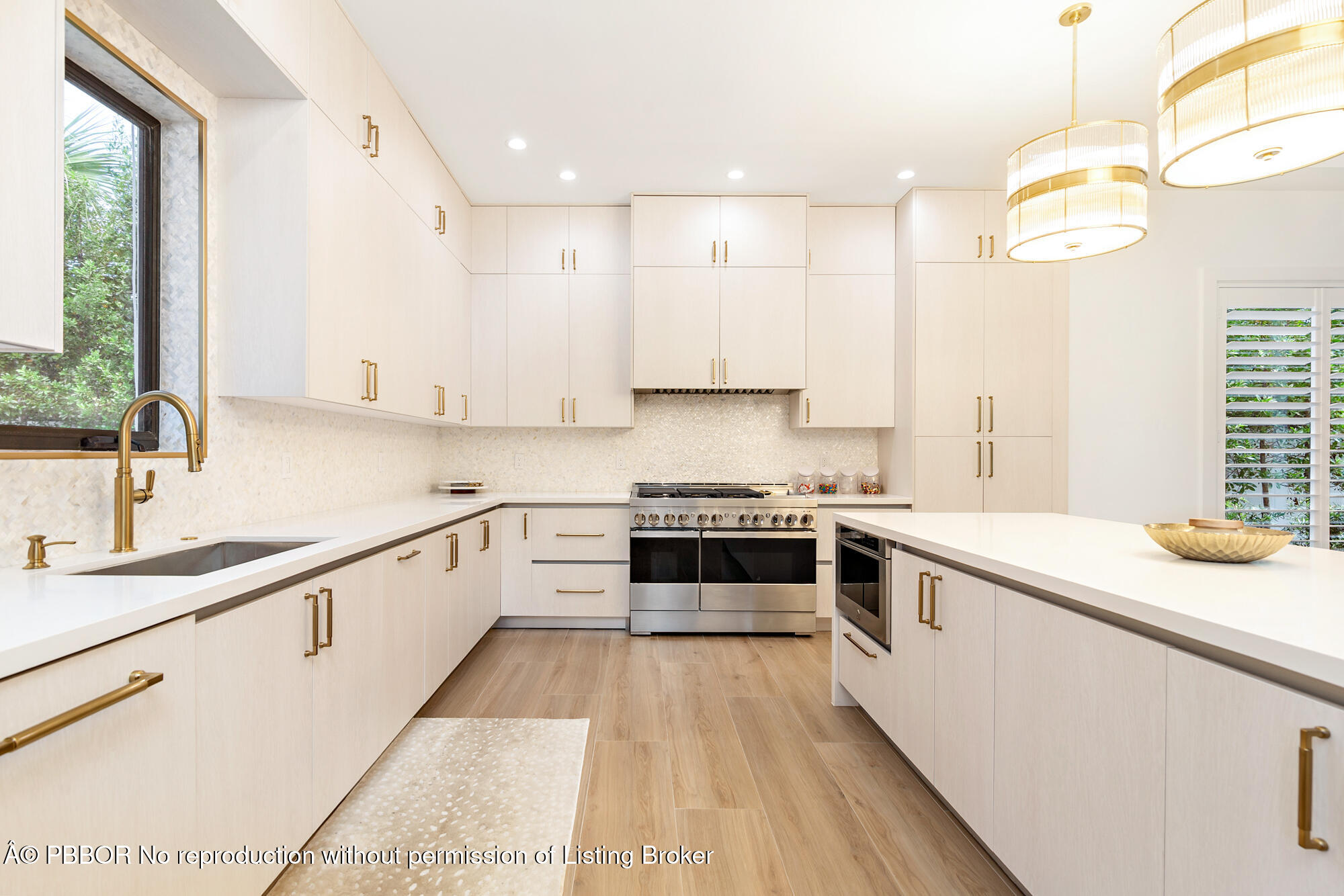 183 Arlington Road West Palm Beach, FL 33405 - Photo 11 of 34 a kitchen with a sink stove top oven and cabinets