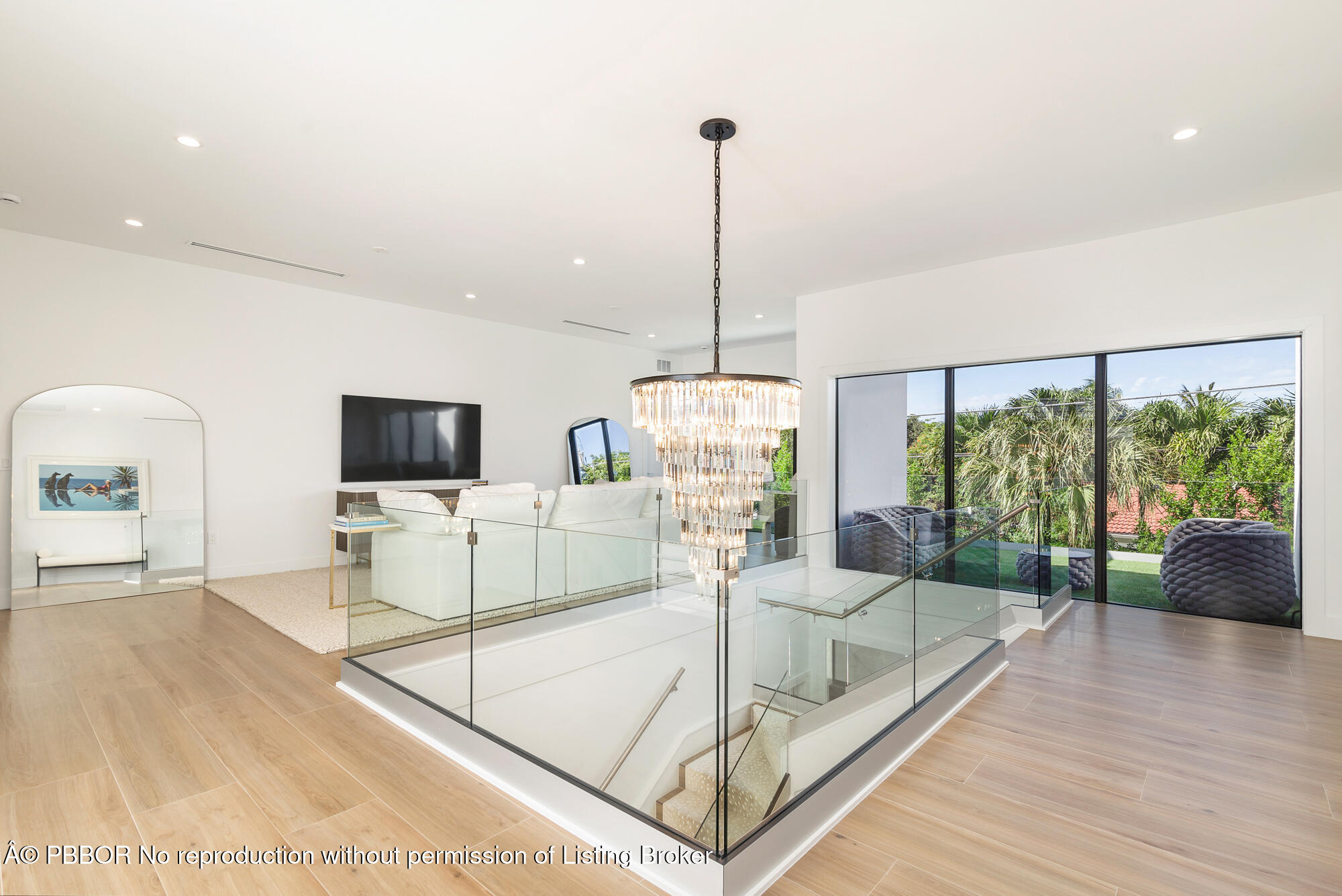 183 Arlington Road West Palm Beach, FL 33405 - Photo 13 of 34 a living room with furniture a flat screen tv and a large window