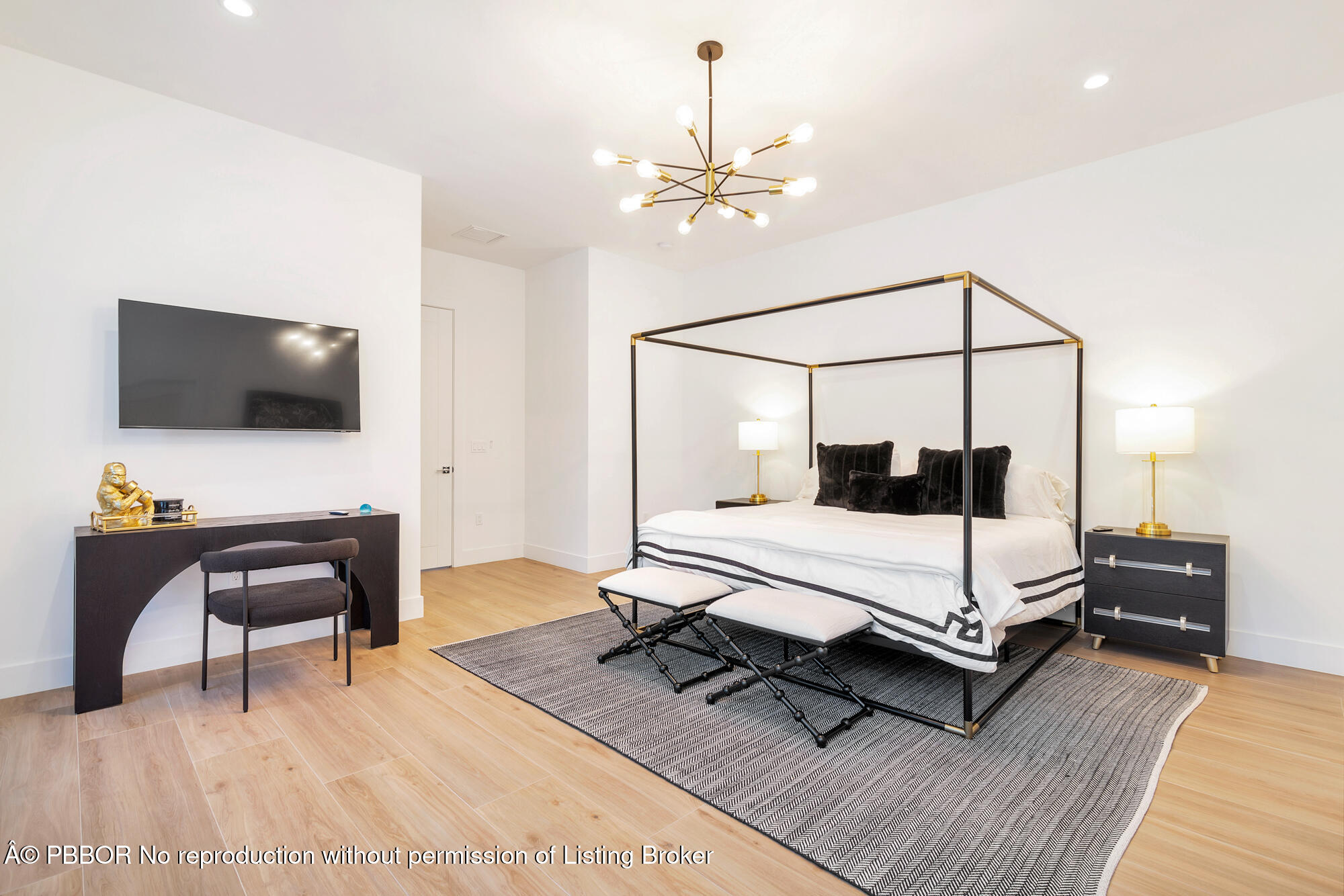 183 Arlington Road West Palm Beach, FL 33405 - Photo 18 of 34 a bedroom with a bed and a flat screen tv