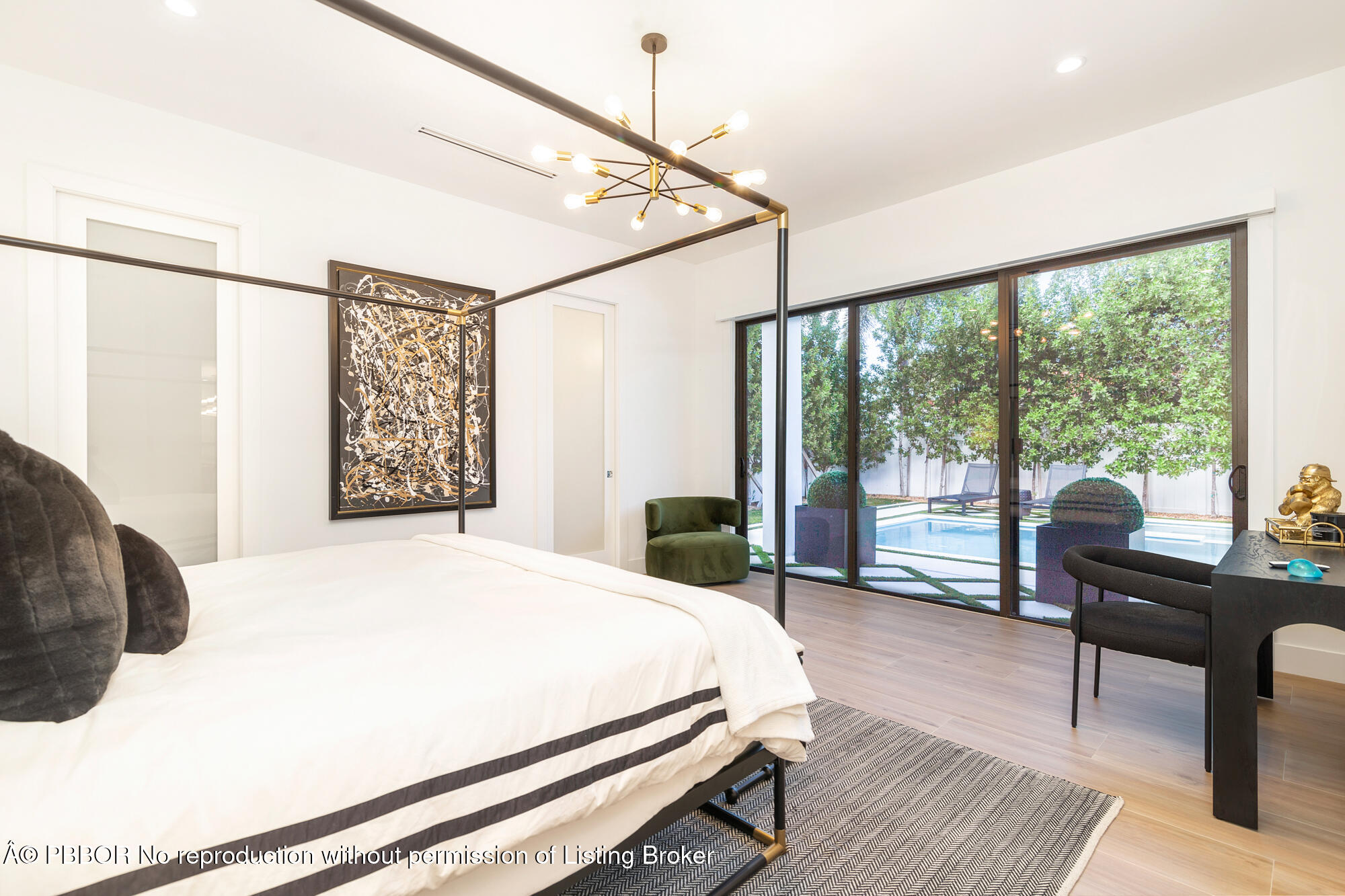 183 Arlington Road West Palm Beach, FL 33405 - Photo 19 of 34 a bedroom with a bed and a large window