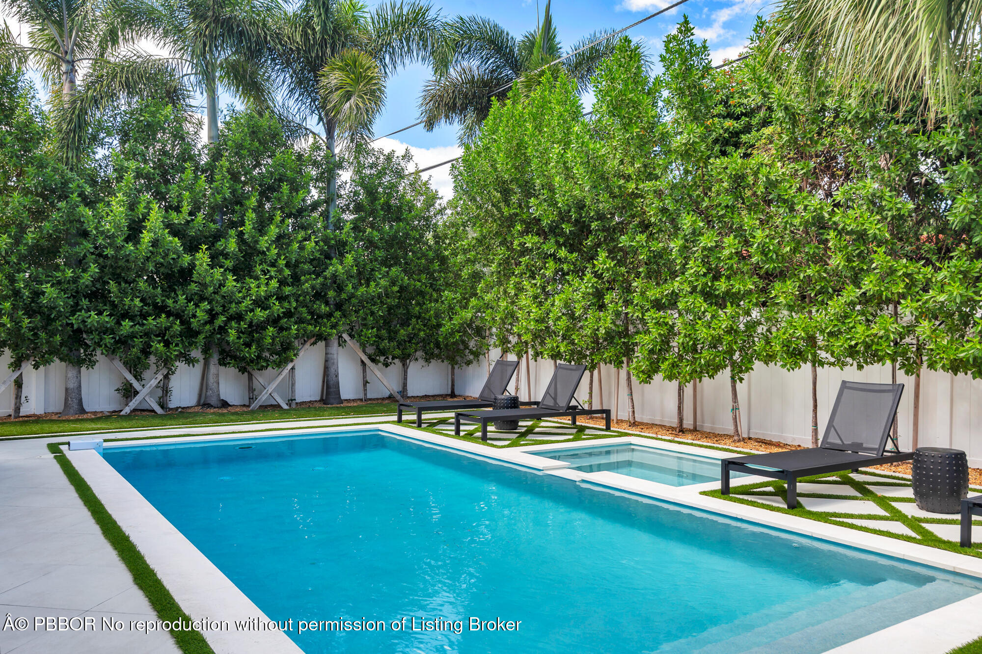 183 Arlington Road West Palm Beach, FL 33405 - Photo 30 of 34 a view of a swimming pool with chairs