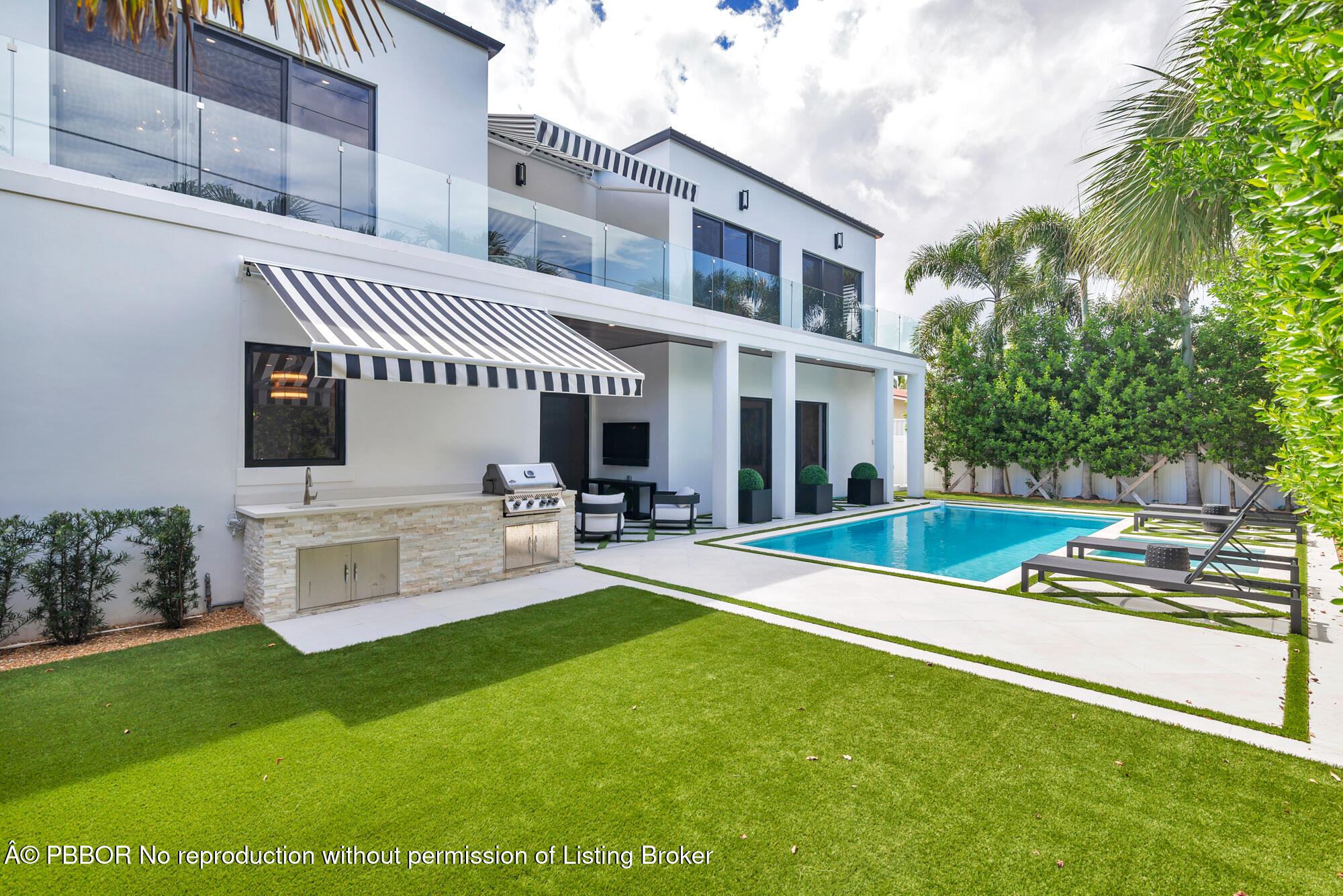 183 Arlington Road West Palm Beach, FL 33405 - Photo 31 of 34 a view of a house with a backyard and a patio