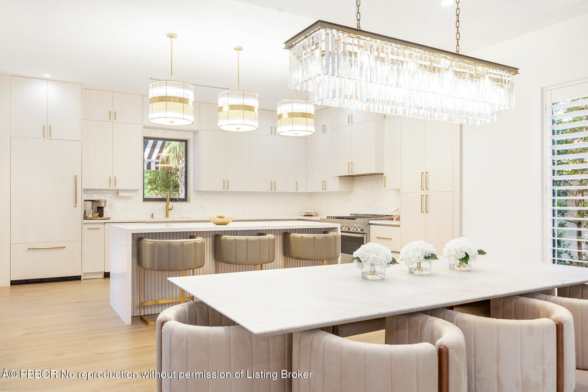 183 Arlington Road West Palm Beach, FL 33405 - Photo 8 of 34 a kitchen with a table chairs stove and cabinets