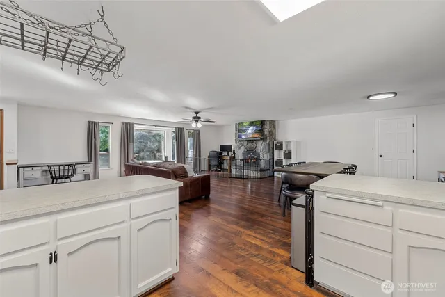 a kitchen with a counter space a sink and appliances