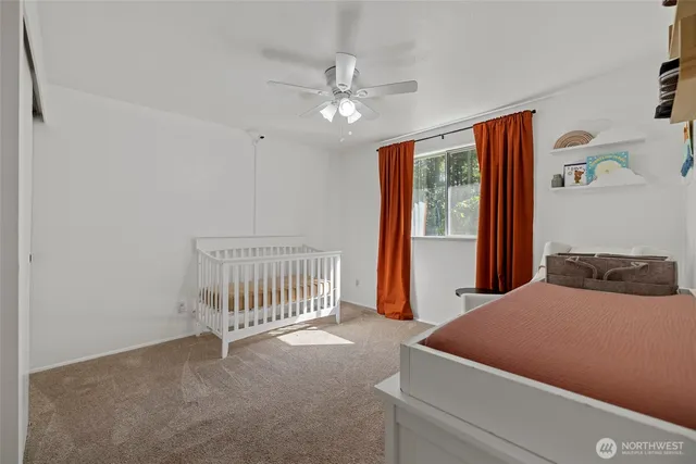 a room with a bed and a chandelier