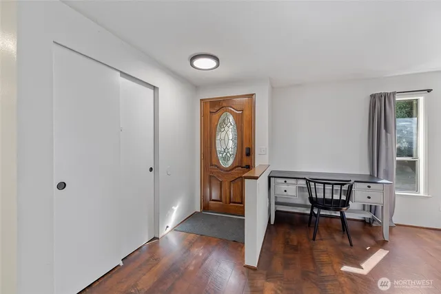 a view of a livingroom with furniture and wooden floor