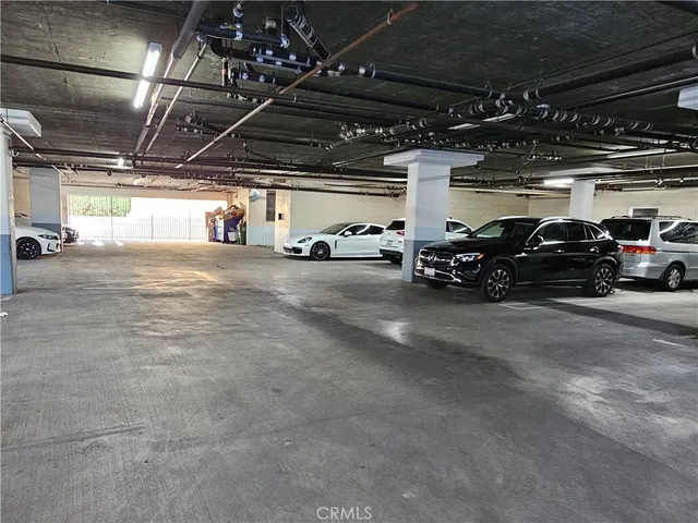 a view of parking garage with cars