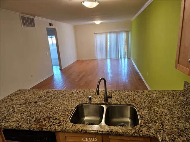 a sink with granite countertop