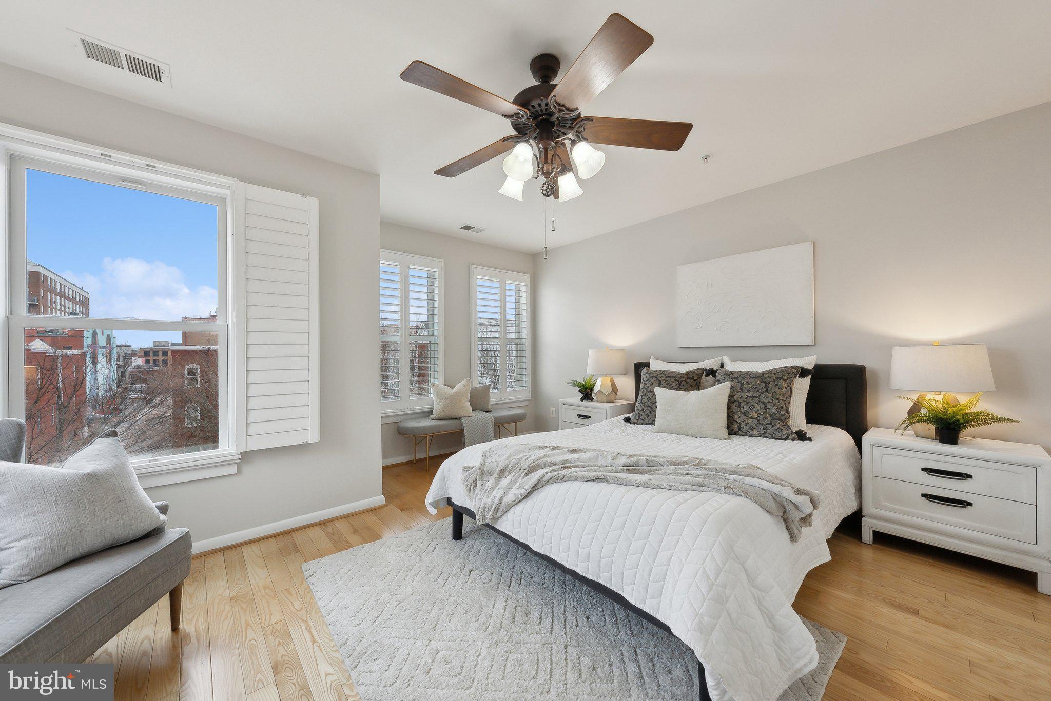 2136 12th Place Northwest Washington, DC 20009 - Photo 13 of 32 a bedroom with a large bed and a chandelier