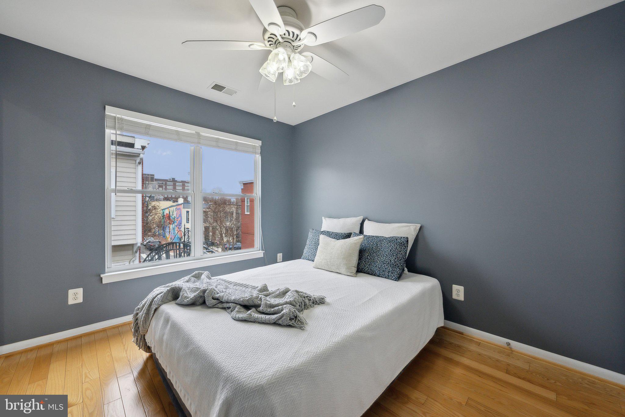 2136 12th Place Northwest Washington, DC 20009 - Photo 17 of 32 a bedroom with a large bed and a window