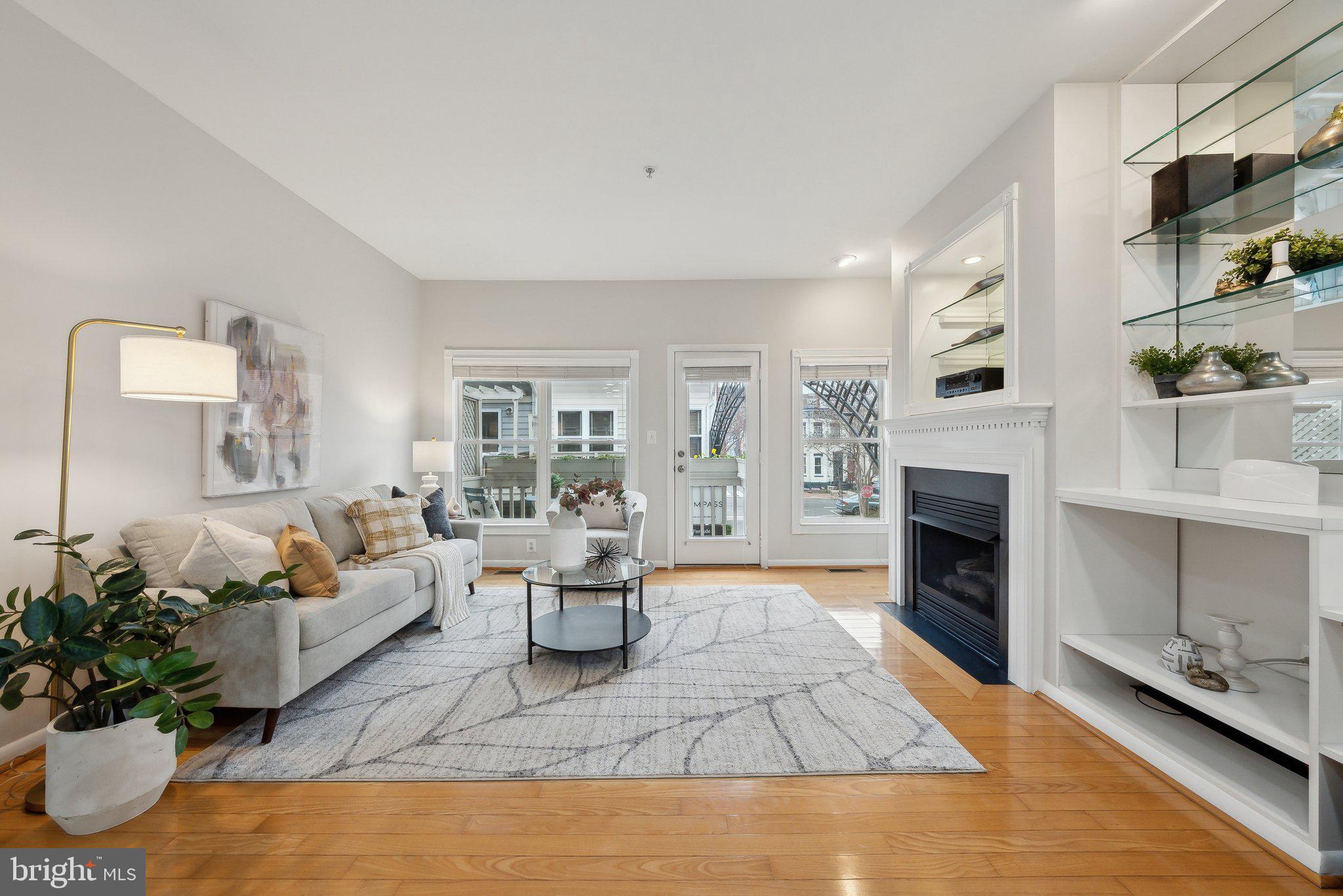 2136 12th Place Northwest Washington, DC 20009 - Photo 2 of 32 a living room with furniture fireplace and potted plant