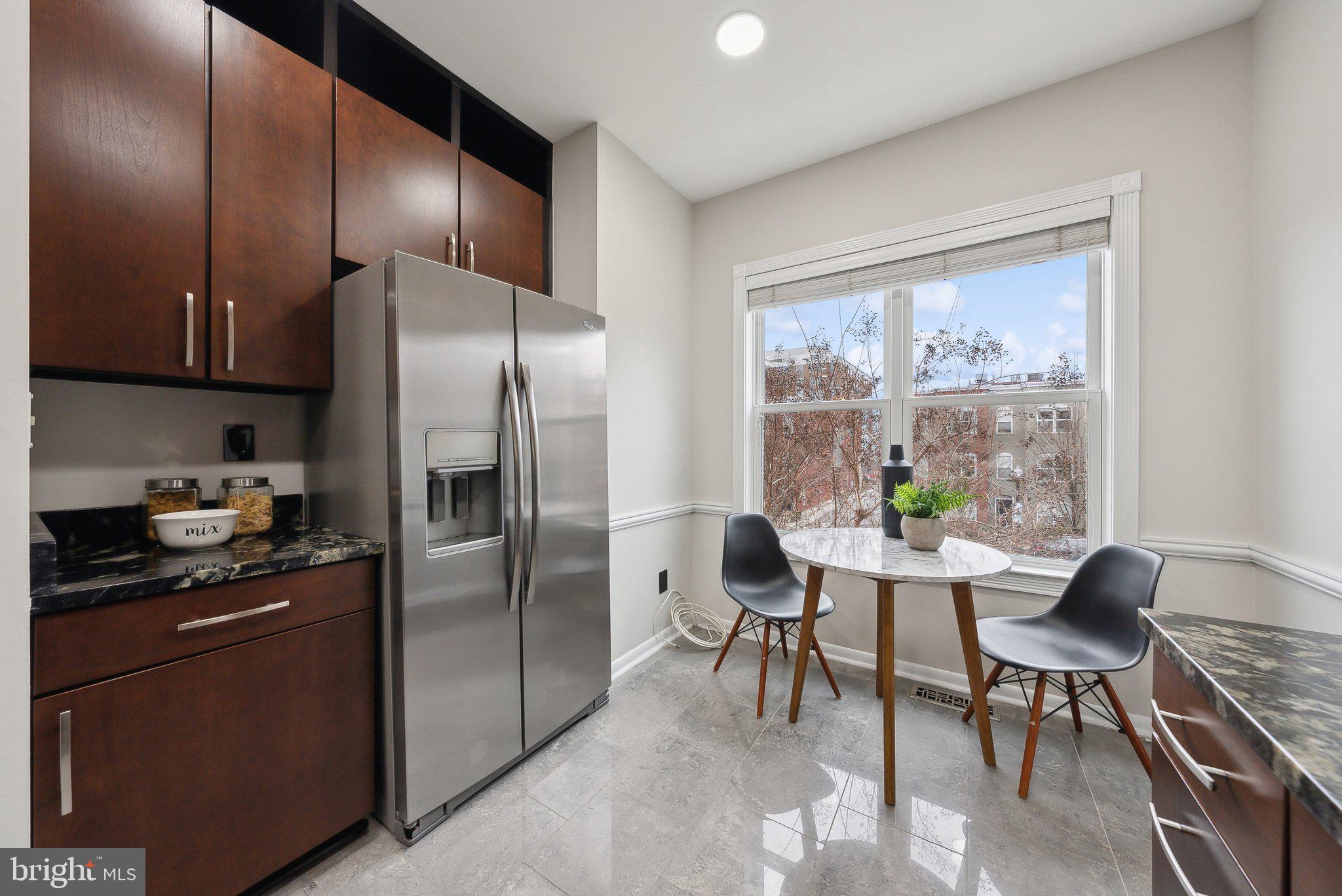 2136 12th Place Northwest Washington, DC 20009 - Photo 9 of 32 a kitchen with stainless steel appliances granite countertop a refrigerator and a stove top oven