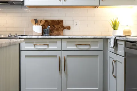a kitchen with a sink and cabinets