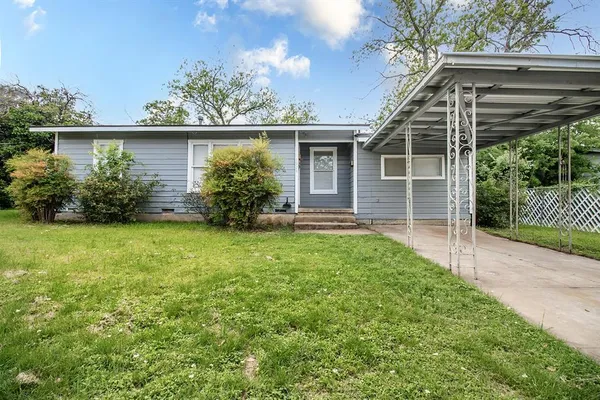 front view of a house with a yard