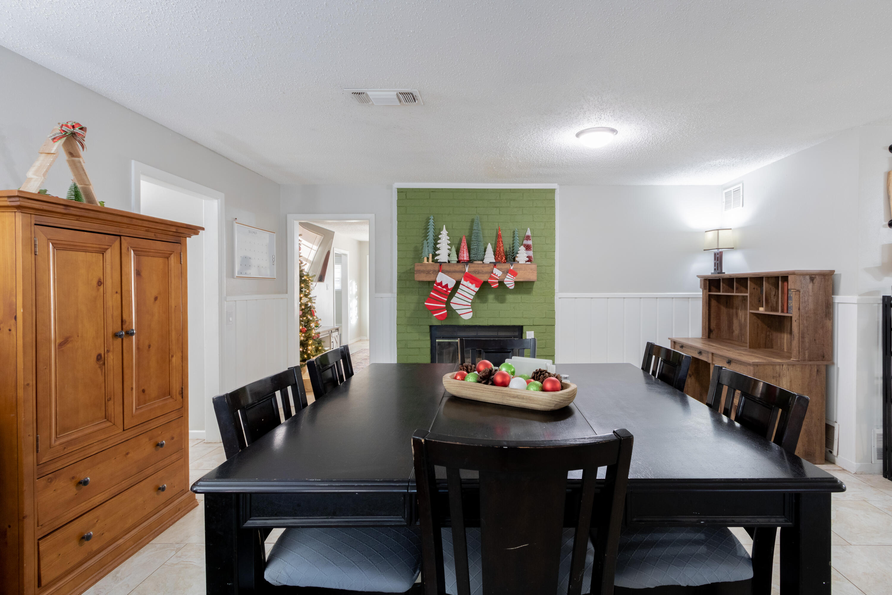 4404 49th Street Lubbock, TX 79414 - Photo 21 of 34 a view of a dining room with furniture and wooden floor
