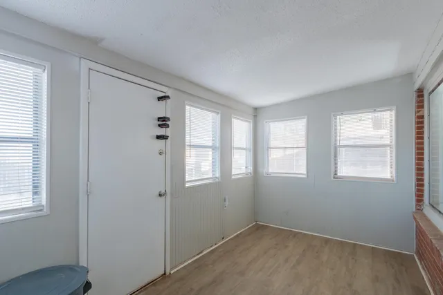 an empty room with windows