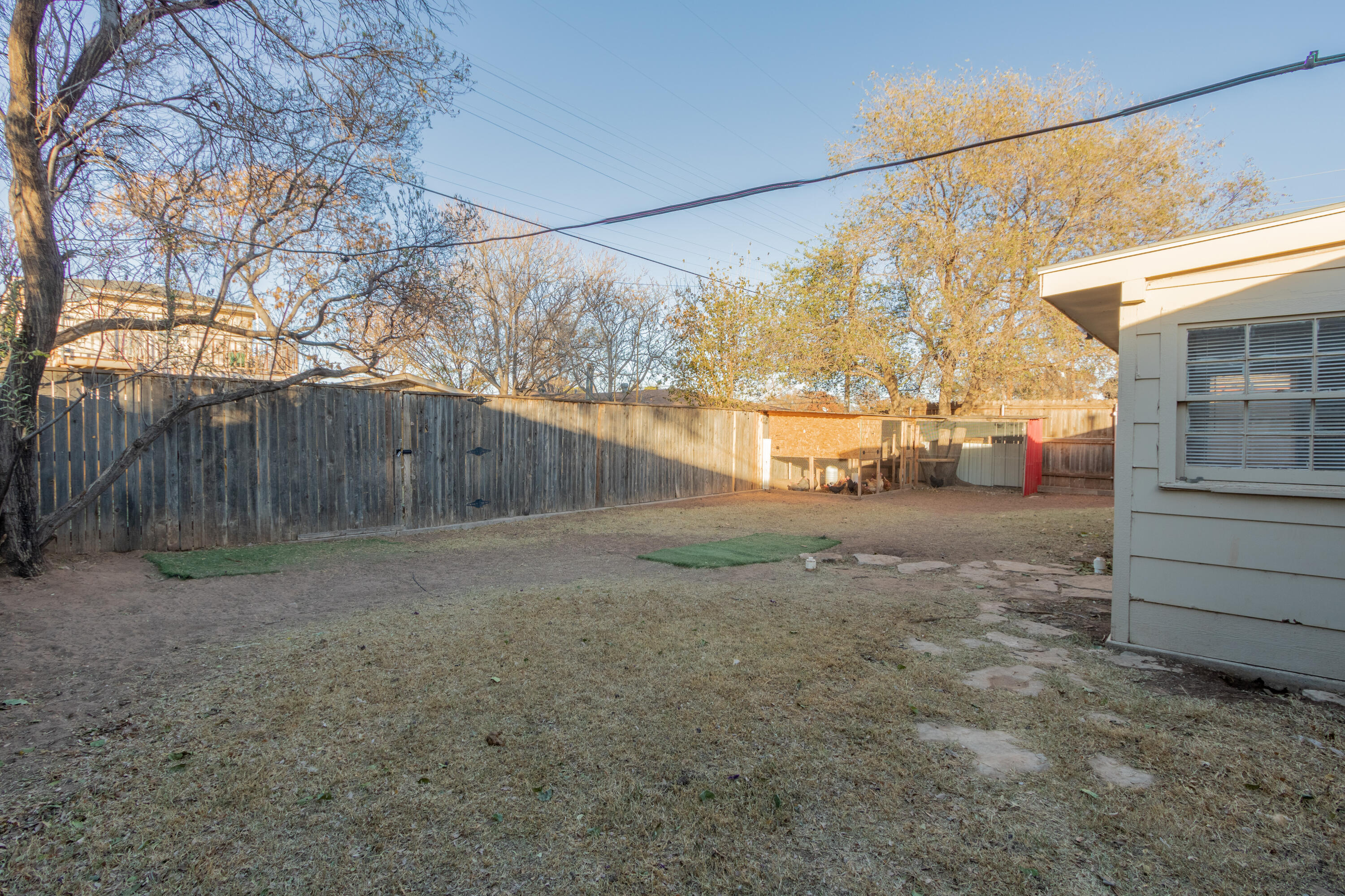 4404 49th Street Lubbock, TX 79414 - Photo 32 of 34 a view of a yard with wooden fence