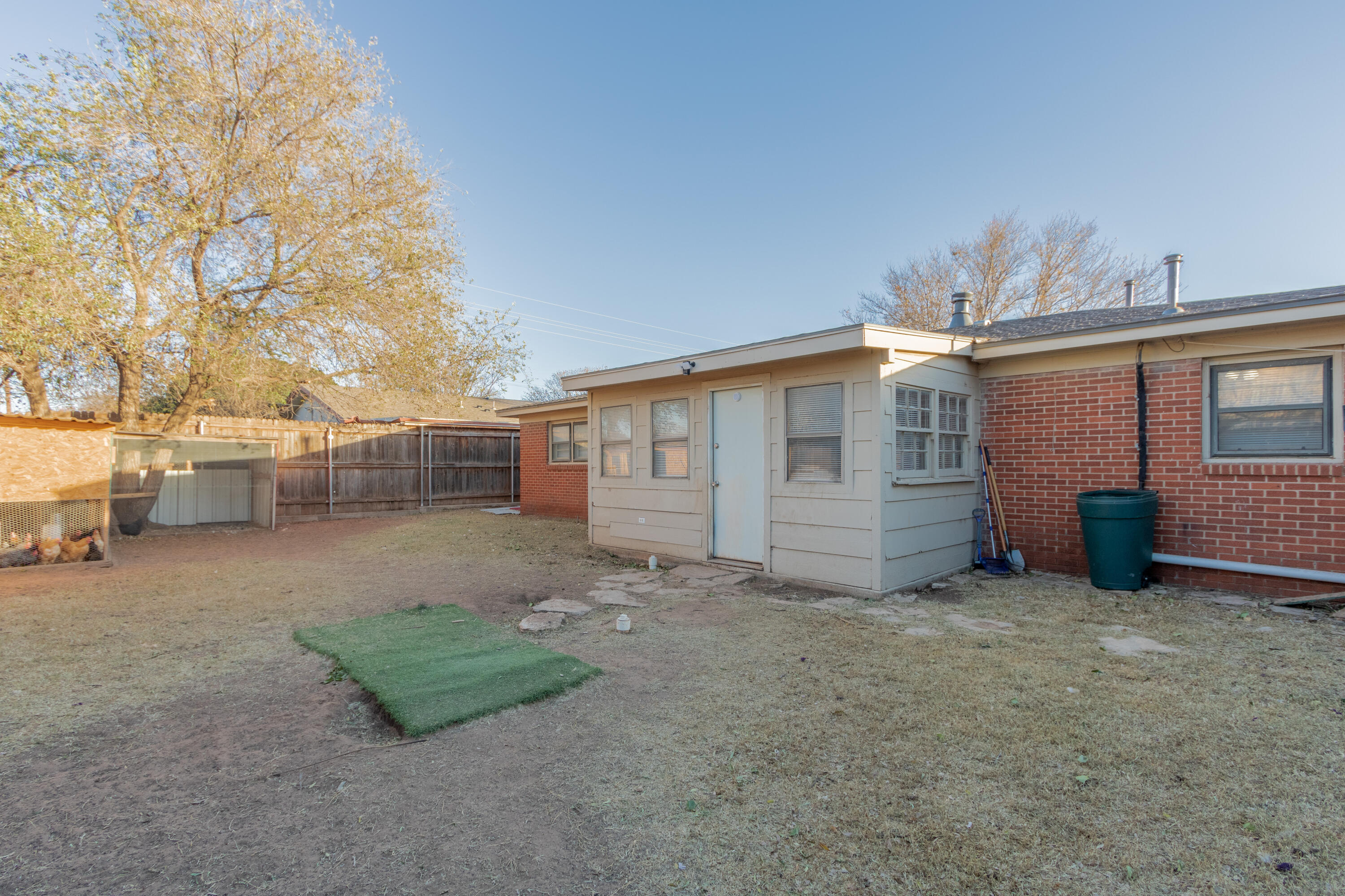 4404 49th Street Lubbock, TX 79414 - Photo 33 of 34 a view of a house with backyard and a tree