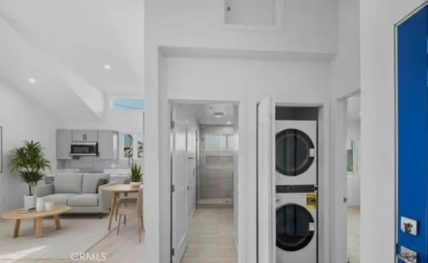 a view of a hallway with washer and dryer