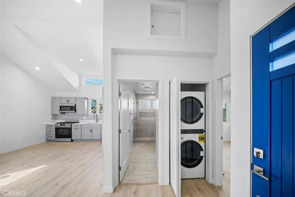 a bathroom with a granite countertop sink a toilet and shower
