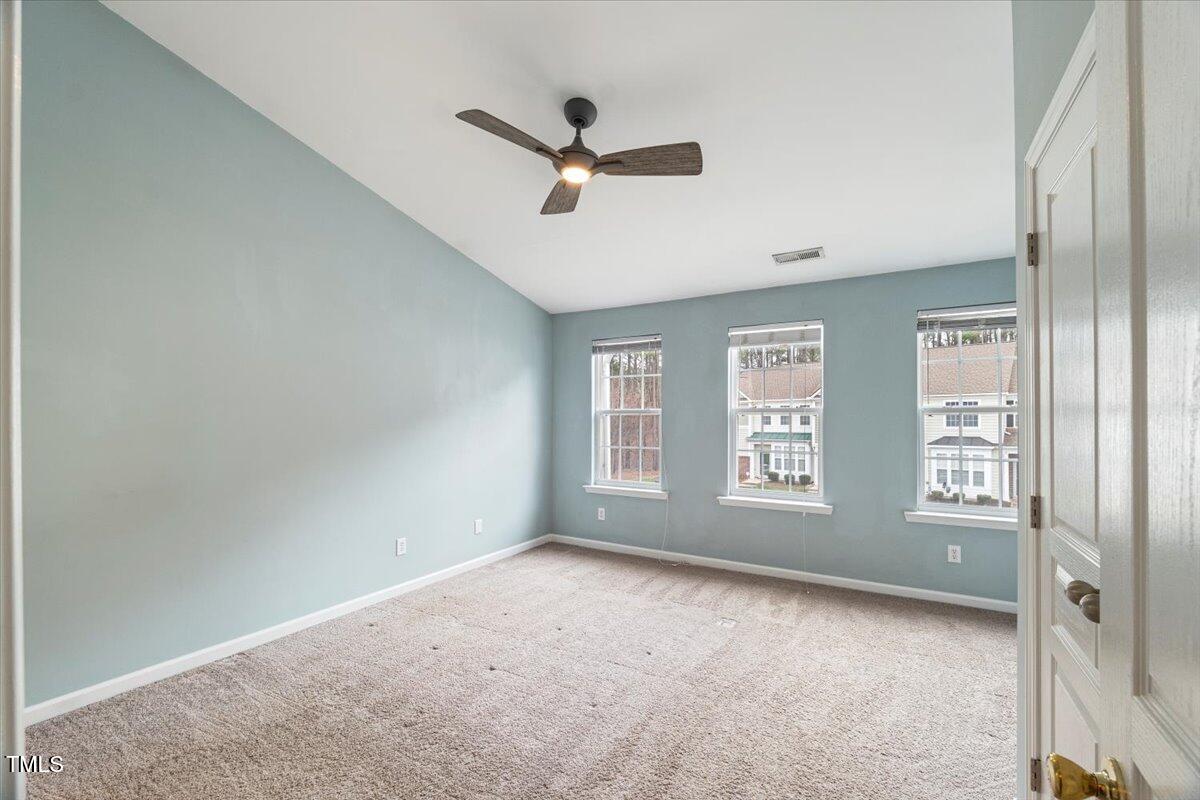 4533 Sugarbend Way Raleigh, NC 27606 - Photo 16 of 37 a view of an empty room with a window