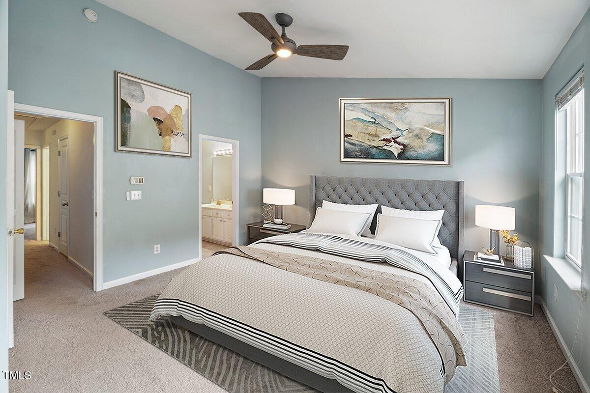 4533 Sugarbend Way Raleigh, NC 27606 - Photo 17 of 37 a bedroom with a large bed and a chandelier