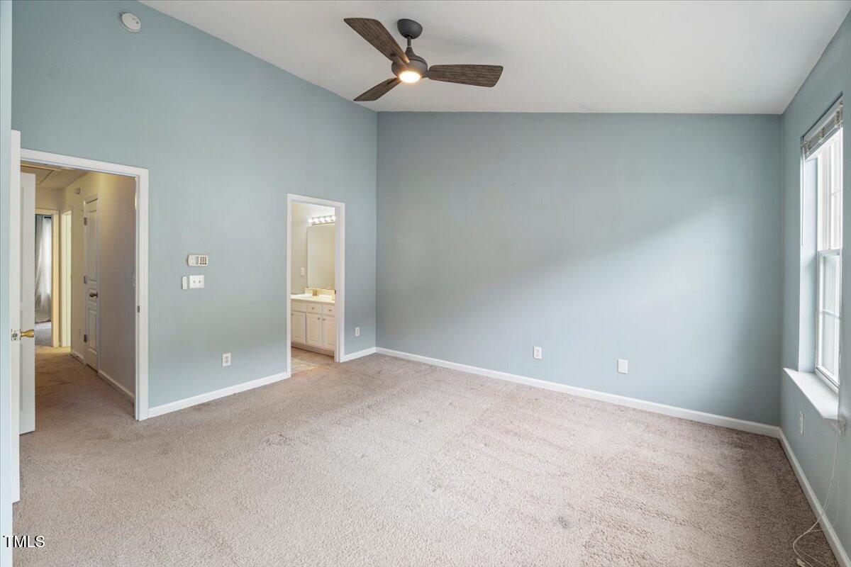 4533 Sugarbend Way Raleigh, NC 27606 - Photo 18 of 37 an empty room with fan and windows