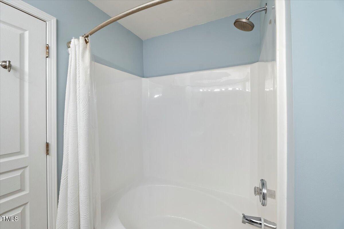 4533 Sugarbend Way Raleigh, NC 27606 - Photo 21 of 37 a bathroom with a shower