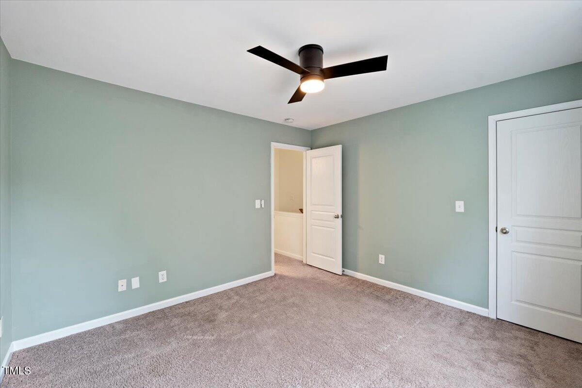 4533 Sugarbend Way Raleigh, NC 27606 - Photo 23 of 37 a view of a room with a ceiling fan