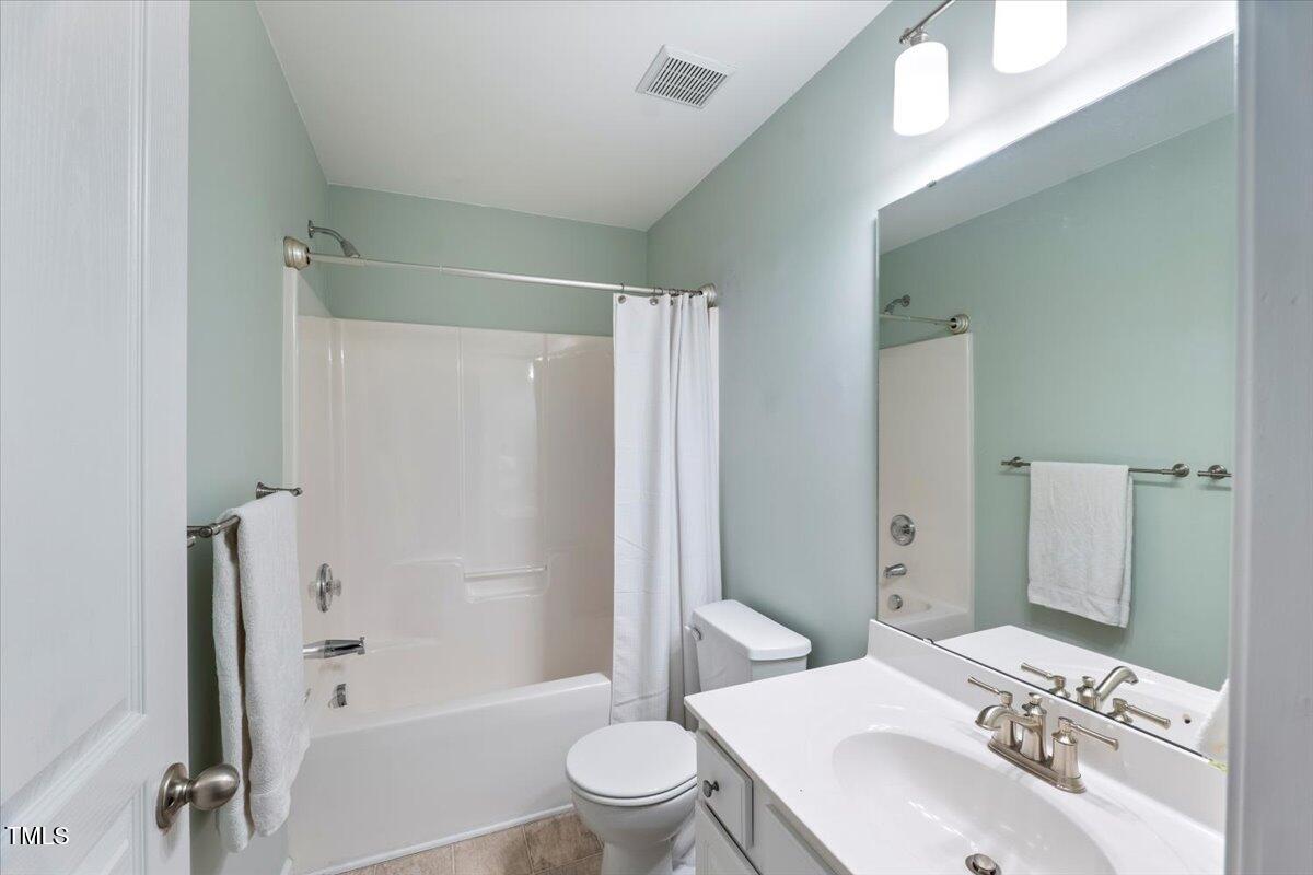 4533 Sugarbend Way Raleigh, NC 27606 - Photo 24 of 37 a bathroom with a sink toilet and shower