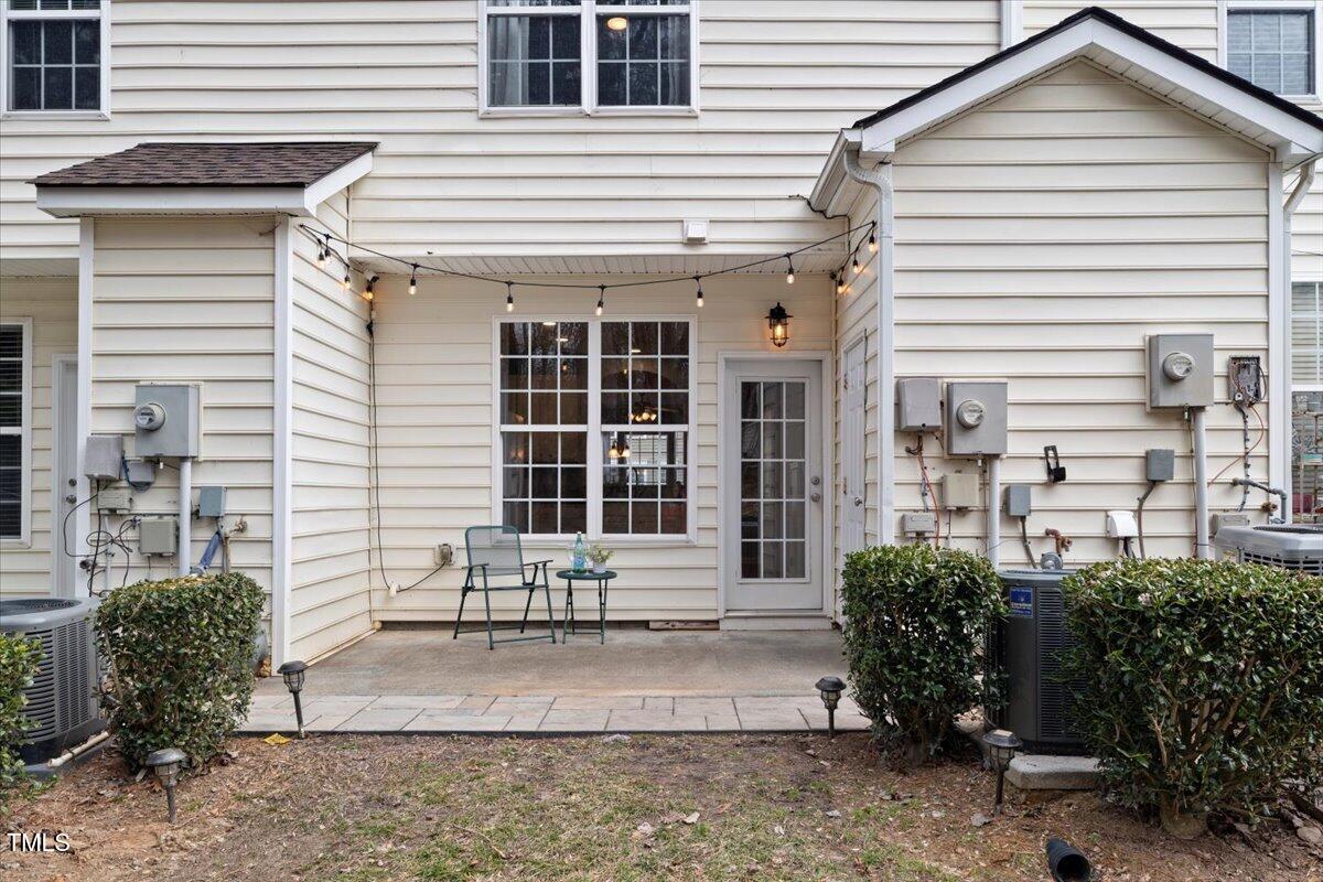 4533 Sugarbend Way Raleigh, NC 27606 - Photo 28 of 37 a front view of a house with a yard and garage
