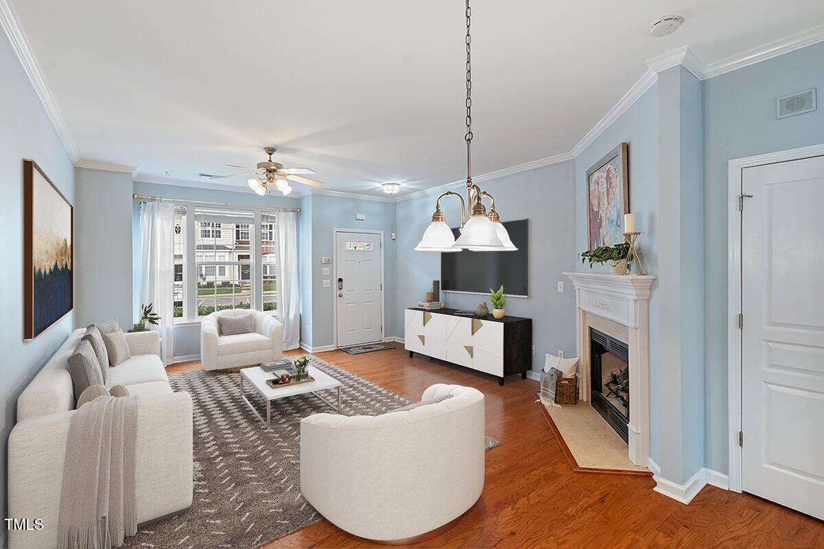 4533 Sugarbend Way Raleigh, NC 27606 - Photo 5 of 37 a living room with furniture and a fireplace