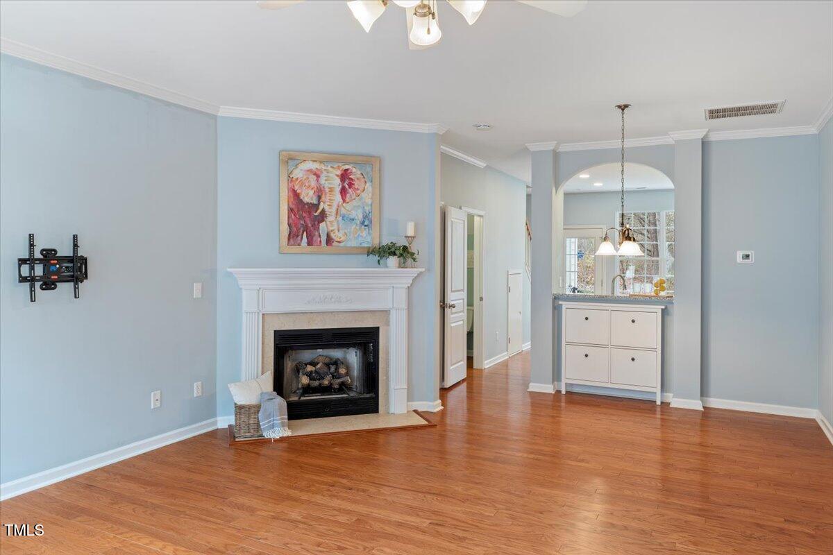 4533 Sugarbend Way Raleigh, NC 27606 - Photo 8 of 37 a living room with furniture and a fireplace