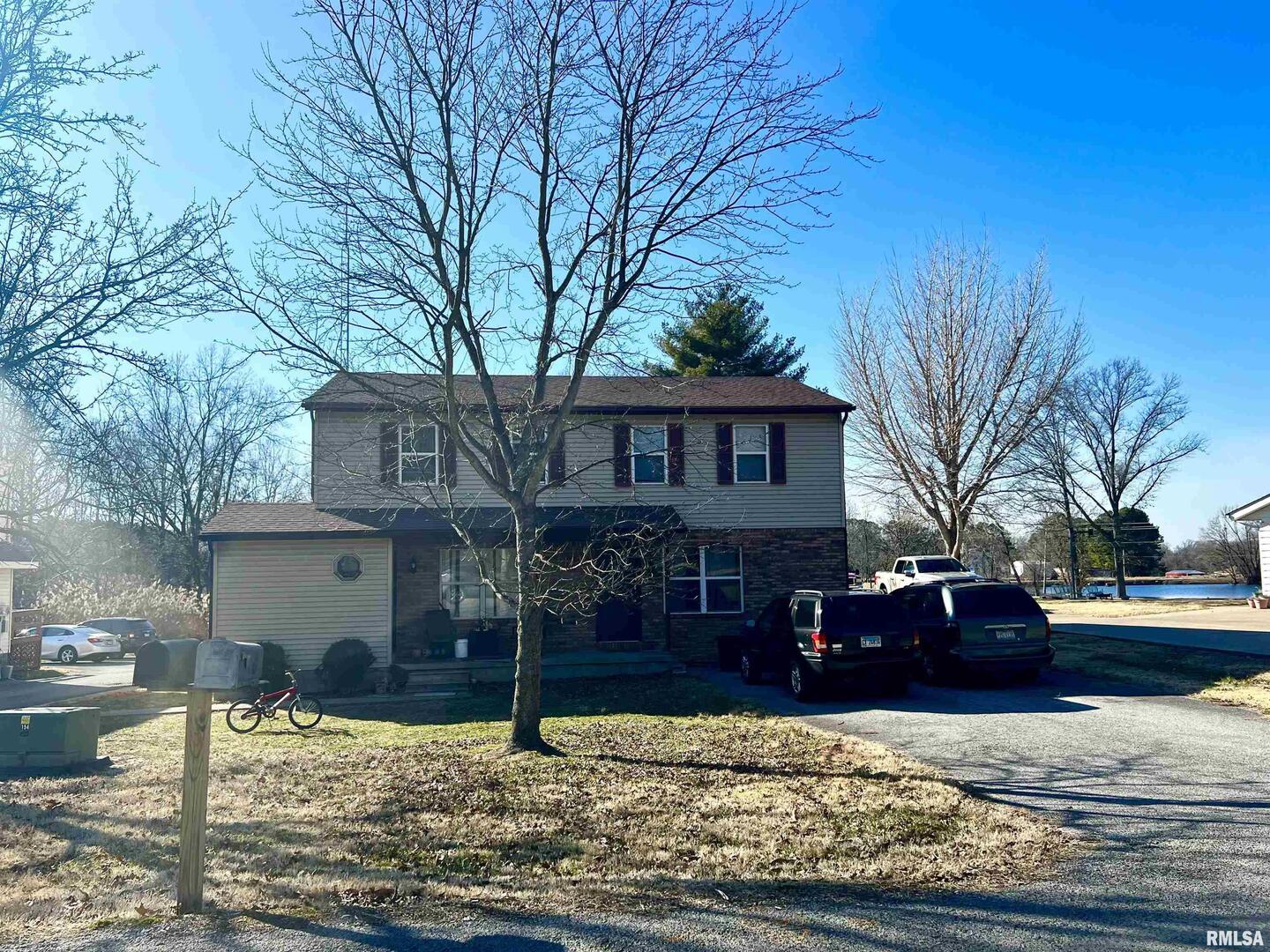 1609 South 22nd Street Herrin, IL 62948 - Photo 12 of 12 a front view of a house with yard covered with trees