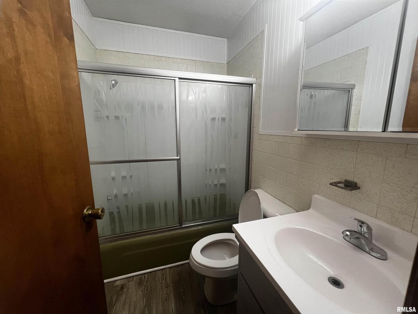 1609 South 22nd Street Herrin, IL 62948 - Photo 10 of 12 a bathroom with a sink a toilet and shower