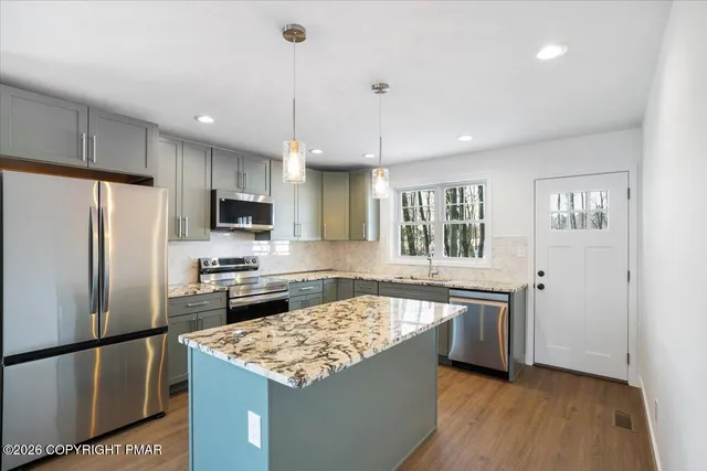 a kitchen with a stove and cabinets