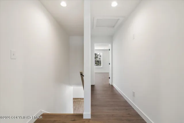an empty room with wooden floor
