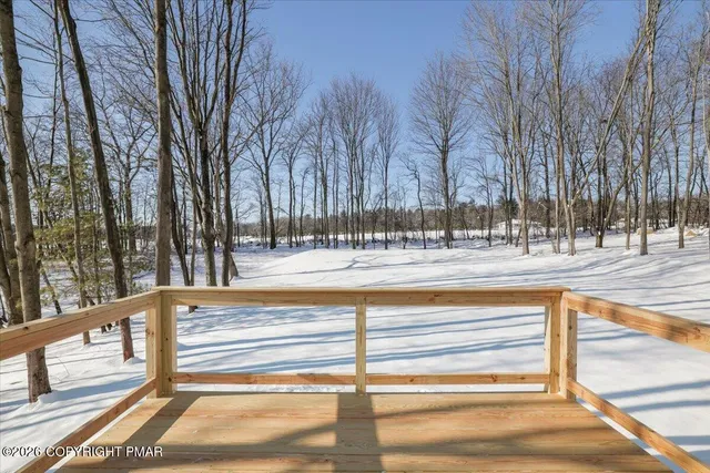a view of fountain with a bench in a yard
