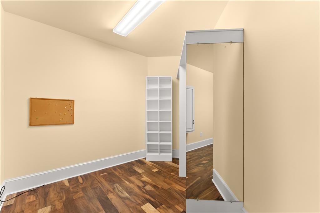 725 County Farm Road Jefferson, GA 30549 - Photo 32 of 66 a view of walk in closet with empty racks