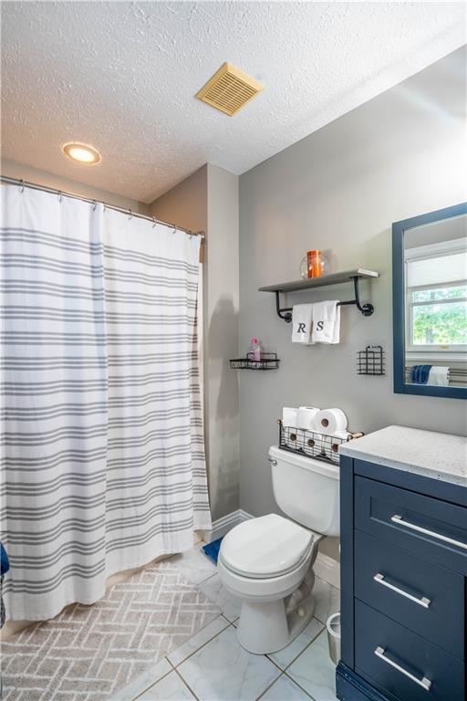 228 Country View Drive Lower Burrell, PA 15068 - Photo 19 of 49 a bathroom with a toilet a sink and a shower