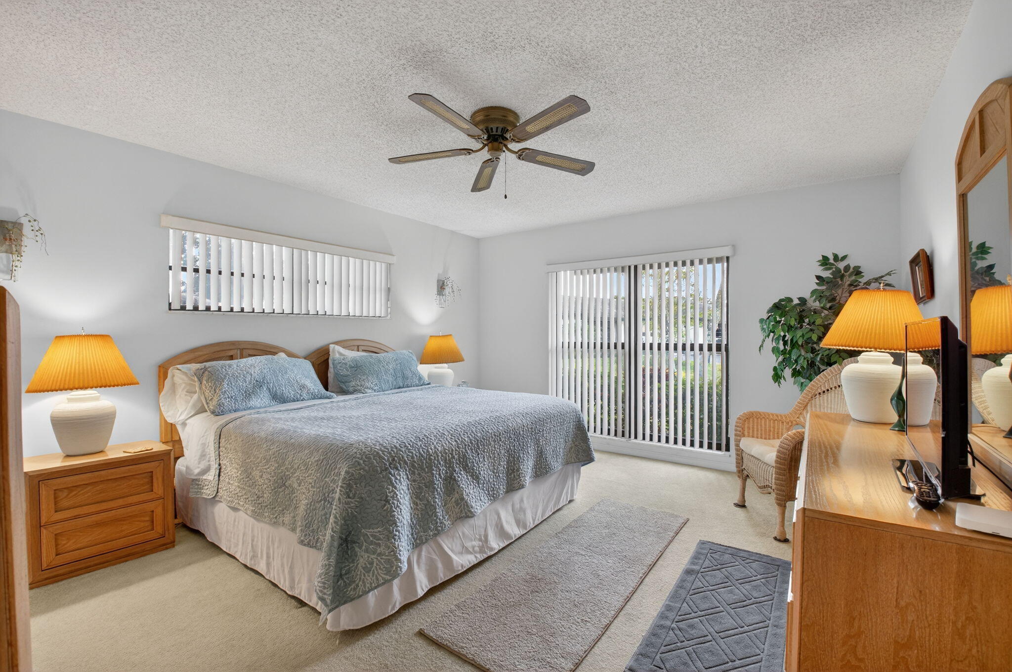 4972 Dovewood Road, Unit B Boynton Beach, FL 33436 - Photo 19 of 47 a bedroom with a bed and wooden floor