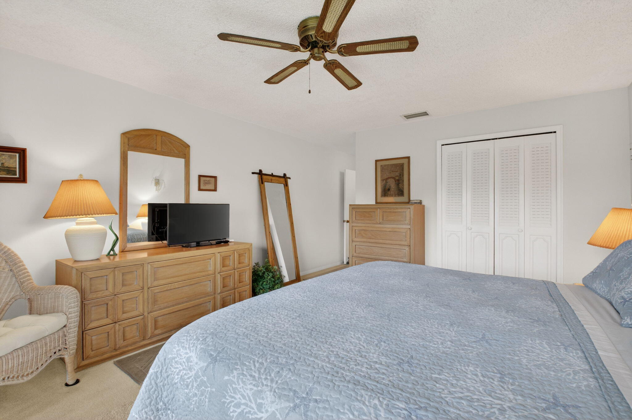 4972 Dovewood Road, Unit B Boynton Beach, FL 33436 - Photo 21 of 47 a bedroom with a bed and a couch